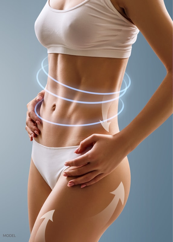 A woman with a tight abdomen showing off her new contours.