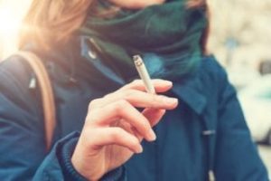 Woman with cigarette in hand